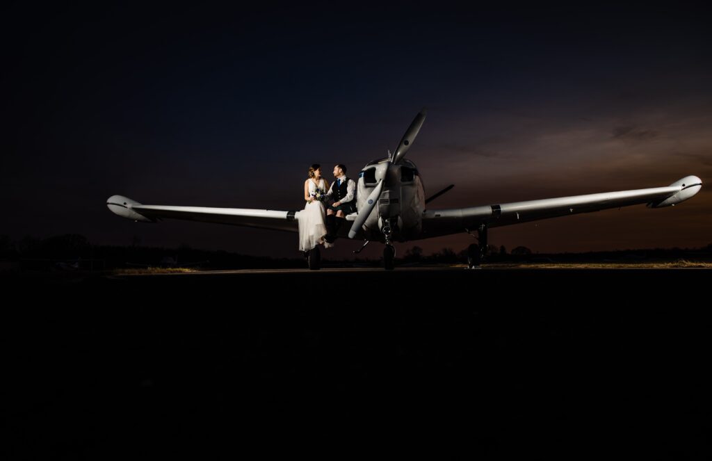 Couple sitting on a plane after sunset in New Jersey