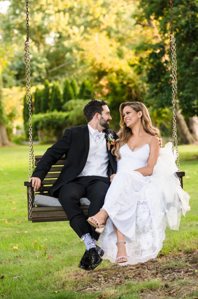 Couple sitting on a tree swing at the backyard wedding in Langhorne, PA