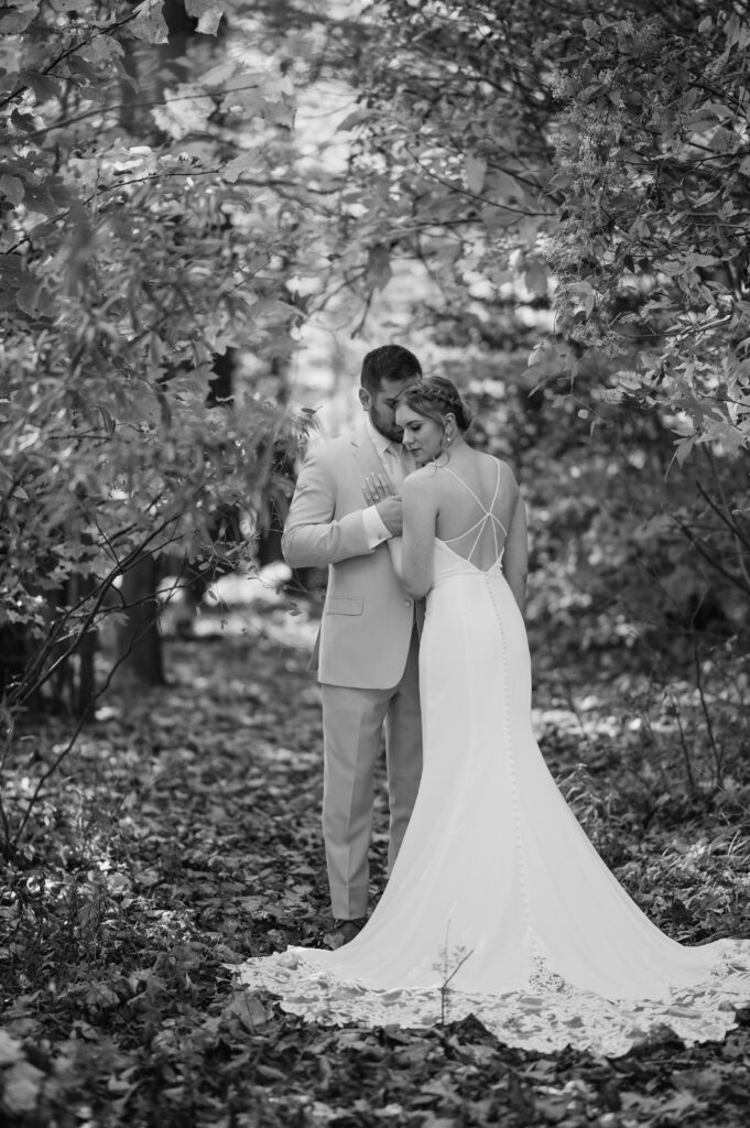 bride and groom in forest at bucks county estate