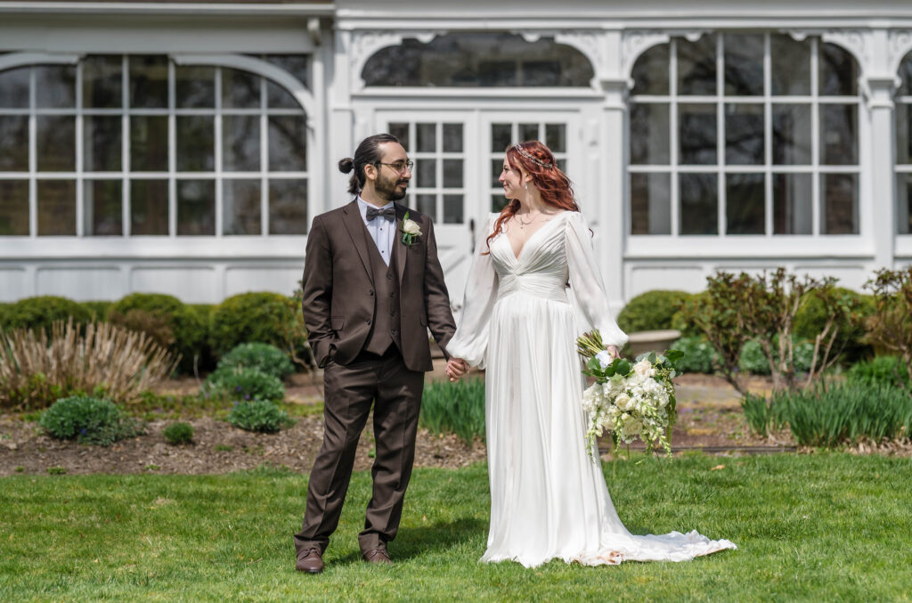 bride and groom looking towards each other at woolverton inn