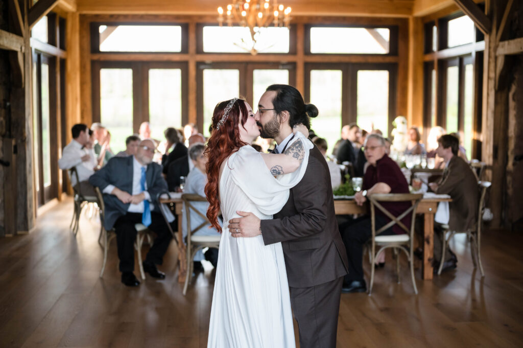 bride and groom kissing during first dance at woolverton inn